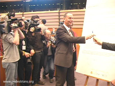 Reporters film mayors signing The Charter of Brussels