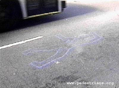 Photo - outline of a human body painted on street
