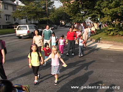 Photo - Students and parents walk to school on International Walk to School Day.
