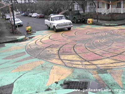 Colorful artwork in a road intersection.