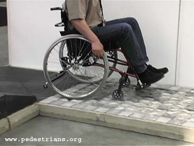 Wheelchair on cobblestone test track.